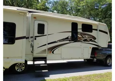 2010 Montana 5th wheel travel trailer with 3 slide outs.