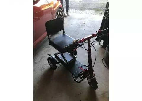 Red three wheel mobility scooter
