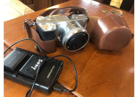 Sony a6000 w/ 16-50mm zoom lens, batteries, leather case
