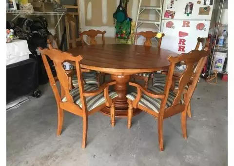 Round solid wood with glass top kitchen table with 6 chairs