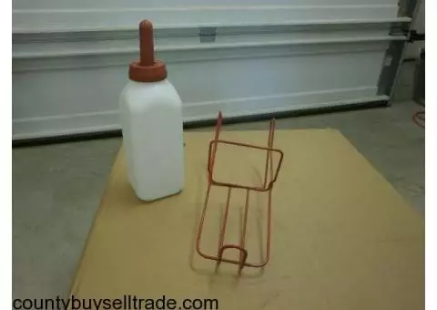 Cow feeding bottles with holders